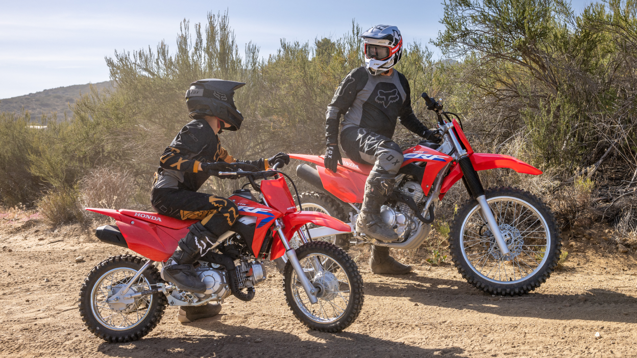 Two riders on Honda CRF Trail dirt bikes