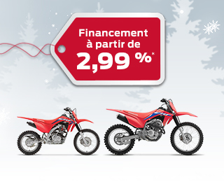 Deux vélos de piste CRF sur fond d'hiver avec des flocons de neige, avec une étiquette de cadeau rouge annonçant un taux d'intérêt de 2,99%
